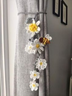 a curtain with flowers attached to it