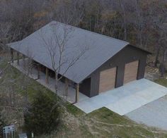 an aerial view of a garage in the woods