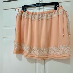 Banana Republic Lace Slip Skirt. Adorable Baby Pink Color With A Delicate And Romantic Silhouette. Chic Pink Skirt With Lace Trim, Pink Mini Skirt With Lace Trim, Pink Lace Trim Mini Skirt, Feminine Mini Skirt For Beach, Pink Skirt With Lace Trim, Pink Flowy Skort For The Beach, Pink Bohemian Mini Length Bottoms, Casual Pink Skirt With Lace Trim, Pink Flowy Skort For Vacation