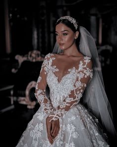 a woman wearing a wedding dress and veil