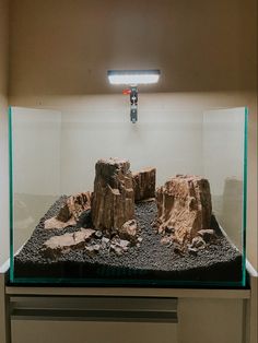 an aquarium with rocks and gravel in it