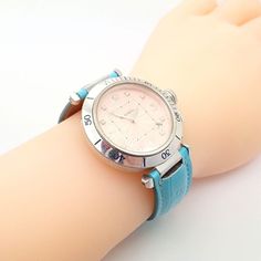 About This Piece:  Brand: Cartier  Case And Clasp Material: 18k White Gold Dial Color: Light Pink Salmon Movement: Automatic, 27 Jewels Functions: Time/Date Case: 38.5mm (Without Crown) x 44.5mm (With Lugs)  Crown: 2.5mm Size Diamond Strap: Genuine Leather, Turquoise Blue  Clasp: 18k White Gold, Original Cartier Size: Fits up to 8" wrist, adjustable strap down to 6.75"  Hallmarks On Back: Cartier 100m/330ft 311808MG 18k (Hallmarks) 2353 Water Resistan Pasha 27 Jewels   Please refer to the dimens Pink Diamond Watch With Diamond Hour Markers, Luxury Watch Accessories With Rotating Bezel As Gift, Luxury Round Cartier Watches, Luxury Diamond Watch With Rotating Bezel As Gift, Luxury Watch With Rotating Bezel As Gift, Luxury Pink Watch Bands, Luxury Watch Bands As Gift, Luxury Watch Accessories With Diamond Hour Markers, Diamond Watch With Rotating Bezel, Round Dial For Gift