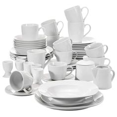 white dishes and cups are stacked on top of each other