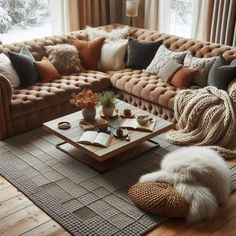 a living room filled with lots of furniture and pillows