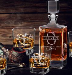 an assortment of personalized whiskey glasses and decanters