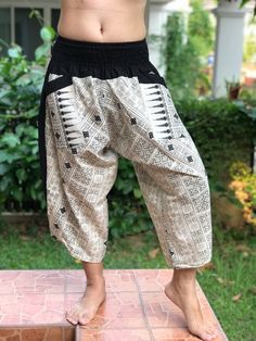 "XL Size - Samurai Pants (Unisex) Elastic Waist MATERIAL: 100% Cotton APPROX MEASUREMENT: Waist: 28\"- 48\" Length: 29\" Around Ankle: 20 inch Category: harem pants, Japanese, ninja pants, pants, samurai, samurai pants, samurai-pants-elastic-waist, thai pants Shipping & Handling * Parcels will be ship via DHL Express FEATURE: Handmade Ethically, Breathable, Unisex, Comfortable to Wear & Stylish. SIZE: One size fits most, elastic waist (see measurement) GENDER: M/F ❤️ PAYMENT We accept pa Traditional Trousers For Festival, Traditional Festival Trousers, Traditional Harem Pants For Yoga, Traditional Harem Pants For Yoga With Pockets, Traditional Yoga Harem Pants With Pockets, Traditional Baggy Bottoms For Festivals, Traditional Harem Yoga Pants, Traditional Black Harem Pants For Festival, Traditional Wide Leg Parachute Pants For Festivals