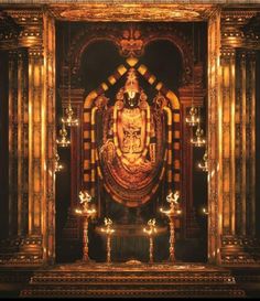 an ornate gold and black shrine with candles lit up in the center, surrounded by columns