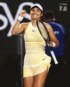 a female tennis player celebrates her victory on the court