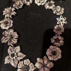 This Stunning Loro Paolo Crystal, Cz And Onyx Necklace Is A Must For The Connoisseur Of Fine Jewelry. Known For Their Uncompromised Quality In All Things Beautiful It Will Make Any Outfit Spectacular And Is The Perfect Pair For That Little Black Dress On Special Occasions Or Just To Make You Feel Special Any Day. It Measures Approximately 17” In Length And Is In Perfect Condition New In The Bloomingdales Box It Came In. The Flowers Are Of Different Sizes, The Smallest About An Inch In Diameter, Sterling Silver Rhinestone Necklaces For Evening, Evening Diamond Necklace With Rhinestones, Luxury Sterling Silver Necklace With Rhinestones, Luxury Silver Necklace With Rhinestones, Elegant Silver Necklaces With Black Diamonds, Luxury Silver Diamond Necklace With Sparkling Stones, Elegant Crystal Jewelry With Black Diamonds, Silver Jewelry With Black Diamonds, Luxury Silver Jewelry With Black Diamonds