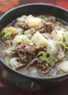 a close up of a bowl of food on a table