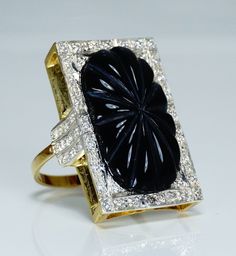 "Magnificent 1970s solid 14 carat gold, carved onyx and 1.25 total carat weight excellent quality diamonds cocktail ring! Measurements: diamonds diameter 2mm (0,07\") frond with dimensions 2,7cm (1,06\") by 1,7cm (0,66\") total weight 5,6 grams Ring size: US size 8 1/2 (diameter 1,85cm / 0,72\") European size 58 1/2 The ring is marked for 14 carat gold with mark 585. Condition of the ring is excellent. Diamonds eye clean with average clarity VVS1. Diamonds color G, nearly colorless. Onyx in perf Formal Diamond Ring With Intaglio, Formal Carved Fine Jewelry Rings, Vintage Black Carved Rings, Vintage Black Carved Jewelry, Black Carved Round Rings, Art Deco Black Diamond Ring For Anniversary, Art Deco Black Diamond Anniversary Ring, Black Art Deco Diamond Ring For Anniversary, Antique Black Diamond Ring For Formal Occasions