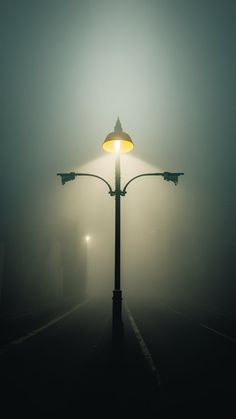 a street light on a foggy night