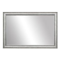 a silver framed mirror on a white wall