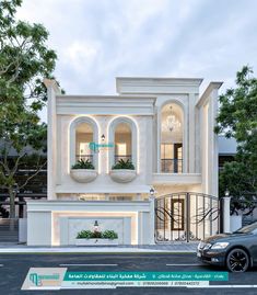 a car is parked in front of a large white building with arched windows and two balconies