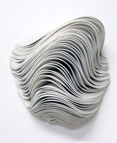 an abstract sculpture made out of folded paper