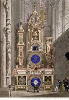 an ornate clock in the middle of a building