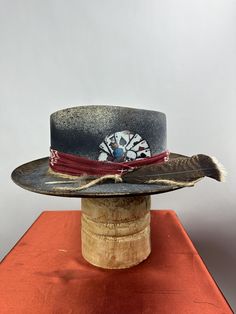 *PRICE INCLUDES $15 HAT BOX* Premium Wool Felt  4 1/4 Crown, 3 inch brim pictured Custom Color, Distressing, Band and Accessories Colors may vary slightly. Although each hat is unique a similar hat can be made in various sizes.  All Sales Final Artisan Straw Hat For Kentucky Derby With Flat Brim, Artisan Flat Brim Straw Hat For Kentucky Derby, Adjustable Fur Felt Hat For Kentucky Derby, Kentucky Derby Fur Felt Top Hat With Curved Brim, Adjustable High Crown Fur Felt Fedora, Adjustable Fur Felt Fedora With High Crown, Adjustable High Crown Fedora In Fur Felt, Custom Fitted Hat With Flat Crown, Custom Fitted Hat With High Crown