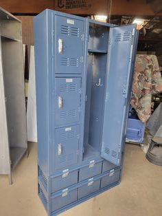 two blue lockers sitting in a garage next to each other