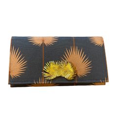 Garland Bags have a cult following and by the looks of this Palm clutch we understand why! The color combination of chocolate brown and cinnamon with the gold palm embellishment make this clutch a showstopper! Evening Wallets With Removable Pouch In Brown, Brown Clutch Bag For Event, Chic Brown Clutch For Gift, Chic Brown Clutch As Gift, Luxury Brown Bags For Events, Chic Brown Evening Bag As Gift, Chic Brown Evening Bag For Gift, Evening Brown Pouch Wallet, Designer Brown Wallet For Evening