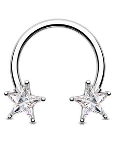 a pair of silver nose rings with crystal stars on each end and an open hoop