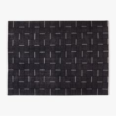 a black and white rug with squares on it