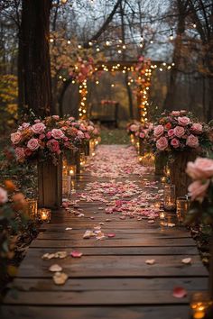 an outdoor ceremony with flowers and candles