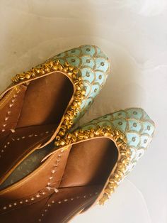 Beautiful Sea Green wedding juttis with gold embroidery and small bells. Club this jutti with your outfit to get the perfect bridal look. *Ethnic Shoes/Women Flats/Handmade Indian Designer Women Shoes or Slippers/Royal shoes/traditional style Women SPECIFICATIONS: *Upper/Panna -Fabric base embellished with sequence, thread work and small bells (ghungaroos) *Back/Adda - Fabric base embellished with sequence and thread work *Lining - Leather *Padding - Double Cushioning for extra comfort *Sole/Tal Festive Zari Work Wedding Shoes, Zari Work Wedding Shoes For Festivals, Dori Work Flats For Wedding And Diwali, Zari Work Wedding Shoes, Bollywood Wedding Flats With Zari Work, Wedding Shoes With Zari Work For Festivals, Festive Gota Work Wedding Shoes, Bollywood Meenakari Flats For Weddings, Wedding Shoes With Dori Work For Festivals