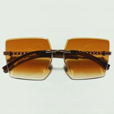 These retro groovy 1970s vintage style sunglasses feature a rim-less squared Gold Rim Design and provide UV 400 protection. Dimensions: Length: 6 inches Lens diameter: 2.5/2.5 inches sunglasses, groovy bachelorette sunglasses, hippie costume, festival, festival style, bohemian, vintage style, 1960s, 1970s, groovy, rock n roll, classic rock, gogo, show girl, Halloween, costume, Woodstock, Penny Lane, Almost Famous, groupie, bandaid, groovy bachelorette party, groovy party 70s Style Sunglasses, Retro Shield Sunglasses With Glass For Summer, 70s Inspired Sunglasses, 70s Fashion Sunglasses, Vintage Square Frame Sunglasses For Spring, Retro Rectangular Shield Sunglasses For Summer, Vintage Shield Sunglasses For Beach In Summer, Retro Gold Sunglasses For Summer, Gold Retro Sunglasses For Summer