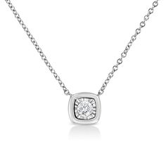 Haven’t we all had the dream of getting ready like a queen for that special day. This square shaped diamond pendant necklace is designed for that queen in you. This 10k white gold pendant is studded with a single 1/10 carat round-cut diamond and is a magnificent sight behold and beautiful adornment for your neck. The diamond is set in a miracle plate for a bigger look and sparkle. This minimalist pendant goes well with all your outfits and the best thing about the shape, style and look of this necklace is that you can wear in with any attire of your choice. And irrespective of the outfit and the occasion, you are going to shine. This petite and darling necklace is a must have in your jewelry box. Minimalist Pendant, Bezel Necklace, White Gold Pendant, White Gold Chains, Cushion Diamond, White Gold Necklaces, Square Pendant, Bracelet Collection, Diamond Pendant Necklace