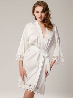 Must have bride bridesmaid robes -made of highest quality charmeuse satin, super soft, light and comfy. Different from normal satin, the buttery soft satin looks and feels like real silk. Gives you the feeling of being at an exclusive spa at home! It will feel so good against your skin. It won't get worse even after repeated washings; Self Tie closure Machine Wash Love the look of bride bridesmaid robes with lace trim? Same—we can't get enough of them! Check out these pretty bridal party robes f Satin Wedding Night Sleepwear, Cream Wedding Robe For Spring, Elegant Solid Satin Sleepwear, Elegant Satin Sleepwear For Spring, Elegant Satin Summer Robe, Elegant Summer Satin Robe, Satin Robe For Wedding Night In Summer, Satin Sleepwear For Wedding Night, Elegant Satin Robe For Honeymoon