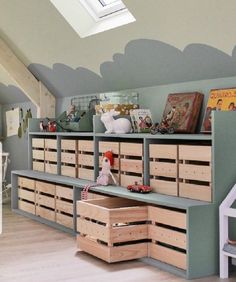 a child's room with lots of storage and toys