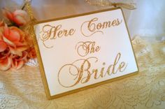 there is a sign that says here comes the bride