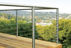 a metal railing on top of a wooden deck