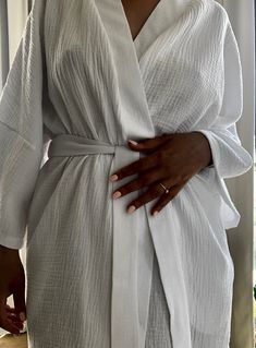 This bathrobe was designed for women who value comfort and love natural fabrics. Cotton kimono made of muslin will warm you in winter and cool you in summer. The fabric is wonderfully soft. I wanted the robe to act as a dress, so you can wear it all day. In one product, I combined several functions to help build a conscious wardrobe. One size kimono Rose-colored kimono GOTS certified natural cotton kimono This bathrobe was created for women who value comfort and love natural fabrics. A cotton ki Long Robe For Lounging, Cotton Open Front Kimono For Loungewear, Cotton Open Front Robe For Loungewear, White Long Kimono For Loungewear, White Sleepwear With Kimono Sleeves For Loungewear, White Relaxed Fit Kimono For Loungewear, Oversized Robe With Kimono Sleeves For Daywear, White Robe With Kimono Sleeves For Loungewear, Oversized Wrap Robe For Loungewear