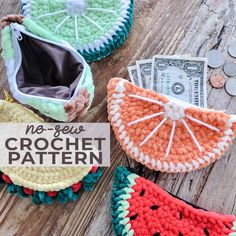 three crochet purses with money in them on a wooden table next to each other