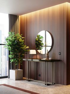 a room with a mirror, plant and lamp on the side table in front of it