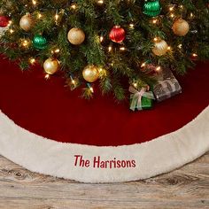 a christmas tree skirt that says the harrisons on it