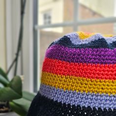 Let's say hello to this colourful bucket hat. Definitely able wearable anytime and at all times as you choose. Handmade of 100% Acrylic yarn that appears summer-rryy but is also suitable for a cold day. Let it with your everyday OOTD or we can have it wrapped as a gift too. Dimensions: Length (Top of hat to end of brim) : 9 1/2 in or 24.1cm Adult size of 20-22 in head circumference Playful Multicolor Cotton Sun Hat, Colorful Casual Bucket Hat, Colorful Casual Bucket Sun Hat, Casual Colorful Bucket Sun Hat, Multicolor Knitted Bucket Hat, Playful Multicolor Bucket Hat, Casual Colorful Bucket Hat, Colorful Crochet Casual Hats, Handmade Colorful Crochet Hat