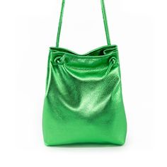 Metallic Green Fun meets function with our perfect summer addition— please meet the Bikini Bag! All the best parts of a shoulder bag (the ease! the class!) but with a twist, because nothing in life should be boring. High quality full grain chrome tanned leather throughout Magnetic closure 10” wide, 12” tall, 3” deep. 8x6 interior compartmentalized pocket. Unlined Colored Leather, Perfect Summer, You Bag, Tan Leather, One Pic, Sale Items, Twist, Shoulder Bag, Green