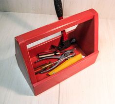 there is a red box with tools in it