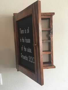 "FREE SHIPPING in the USA This essential oil cabinet has 4 shelves and can hold over 100 5 ml bottles. The door painted in a chalkboard paint, allows you to store your oils in the dark. The shelf has a magnetic closure to keep the door securely closed. The shelf measures 18\" x 13\" x 4\" The shelf can be wall hung or placed on a flat surface. We also have several other color finishes to choose from in our ETSY shop. Each case is completed with your color choice and a clear coat. This unit is sh Wooden Essential Oil Holder, Diy Essential Oil Holder, Essential Oil Cabinet, Essential Oil Organization Storage, Essential Oil Display Ideas, Essential Oils Storage Ideas, Essential Oil Storage Ideas, Organize Essential Oils, Essential Oil Rack