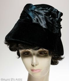 Pretty, 1920's-30's ladies cloche hat. Black polyester velvet & satin, over foam, with velvet covered button accent. Fully lined with black poly satin. One size fits up to 22" Theater -  Gangster / Flapper Theme Parties / Murder Mysteries.                                                                                                                                                                 5180 Formal Black Cloche Hat For Winter, Black Formal Winter Cloche Hat, Victorian Evening Hats For Kentucky Derby, Classic Evening Cloche Hat For Kentucky Derby, Classic Fitted Cloche Hat For Evening, Classic Cloche Hat For Evening At Kentucky Derby, Gatsby Style Short Brim Costume Hats For Evening, Winter Evening Top Hat With Curved Brim, Evening Winter Top Hat With Curved Brim