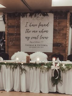 a long table with candles on it and a sign hanging above it that says i have found the one everyone my soul loves