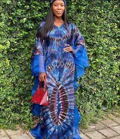 🎈This Nigeria Adire Tie & Dye silk dress is made of high quality chiffon silk that feels good on the skin with organza fabric detailing at the ends of the sleeves. Look simple, yet sophisticated enough to steal all the attention. 🎈This tie dye adire kaftan dress is easy to wear, comfortable, and very stylish. The bubu long dress has a round neckline and a free kimono organza sleeve. It can also be worn as an off shoulder dress on 1 side or both sides. Look like an African Queen in this gorgeou Silk Styles Nigeria, Blue Silk Dress For Festivals, Blue Bohemian Fitted Gown, Blue Fitted Bohemian Gown, Fitted Bohemian Blue Gown, Bohemian Silk Floor-length Gown, Blue Batik Print Festival Dress, Festive Batik Print Maxi Dress, Blue Silk Kaftan For Weddings