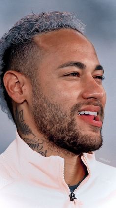 a close up of a person with a beard and tattoos on his face, wearing a white shirt