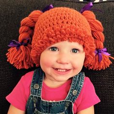 Cabbage patch dolls are a timeless classic and now you can dress up your little one in this adorable hat.  This hat is my shop's best selling item.   Originally this hat was a custom order for a person at our local farmer's market (the orange hat pictured).  I then decided to make my youngest daughter a Raggedy Ann colored hat for Halloween.  I used our hat to complete our her Halloween costume, but she wears it for dress up and also just to keep warm.  This hat can be made in any color. If you'd like a color that is not one of the options, just leave me a note or message me and we can figure it out.  Also there is not an option for ribbon color, please leave a note or message me about the color of ribbons you'd like to accompany the hat.  SIZE CHART Newborn (12 to 14 inch head circumferen Cabbage Patch Costume, Cabbage Patch Hat, Braided Pigtails, Crochet Mickey Mouse, Hat With Braids, Orange Hat, Crochet Winter Hats, Orange Hats