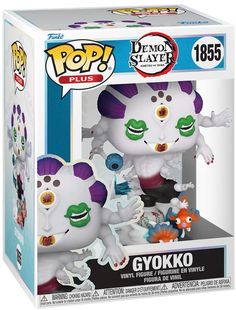 a pop vinyl figure in a box with an image of a demon and other characters