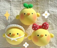 two yellow chickens with bows on their heads and one is wearing a red polka dot bow