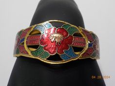 Vintage gold tone hinged cloisonne bracelet. 1" x 7" adorned with gorgeous bright red enamel & cloisonne designs. Excellent condition. Handmade Red Enamel Bracelets, Red Enamel Bangle Jewelry, Handmade Enamel Bangle, Vintage Enamel Cuff Bracelet Gift, Red Enamel Bracelet Jewelry, Vintage Enamel Cuff Bracelet As Gift, Red Enamel Collectible Jewelry, Red Enamel Bangle, Red Meenakari Bracelet