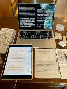 an open laptop computer sitting on top of a wooden desk